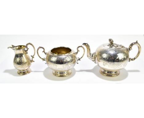 JAMES DIXON & SONS; a Victorian hallmarked silver three piece tea service, each with chased scrollling and floral detail surr