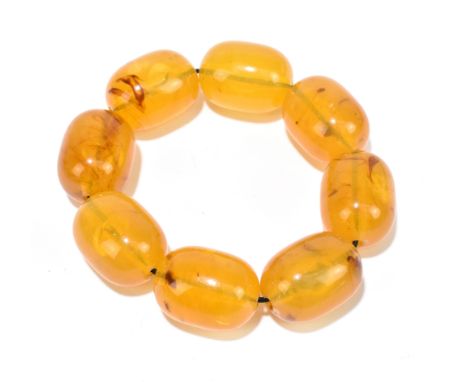 A pale amber coloured bead bracelet formed of eight matched beads, each approx 32 x 22mm, approx 58.3g.Additional Information