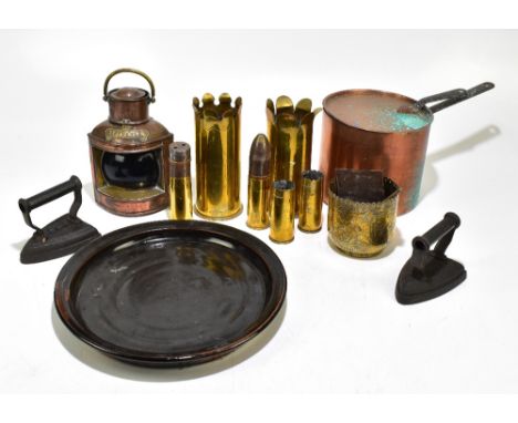 A collection of assorted metalware to include a copper, various trench art shells, a copper starboard lamp, etc.