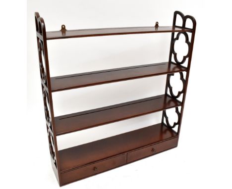 A reproduction mahogany hanging shelf with pierced sides and three shelves above two drawers, length 81cm, depth 19cm, height