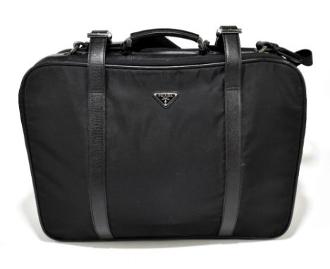 PRADA; a black Saffiano leather and nylon suitcase with detachable strap, removeable leather name tag, nylon lining, zip and 