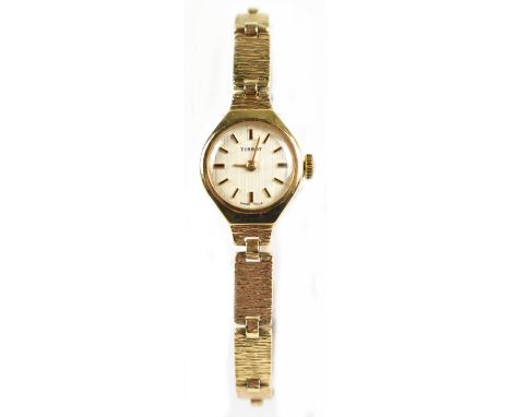 TISSOT; a lady’s 9ct yellow gold mechanical cocktail bracelet watch, the circular dial set with baton numerals, diameter excl