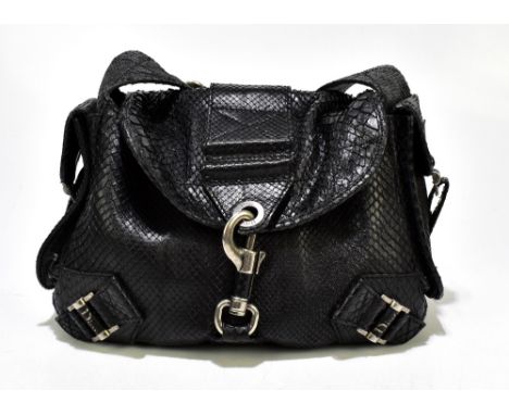 CHRISTIAN DIOR; a limited edition black python leather shoulder bag with side pockets, antiqued silver tone hardware, flap cl