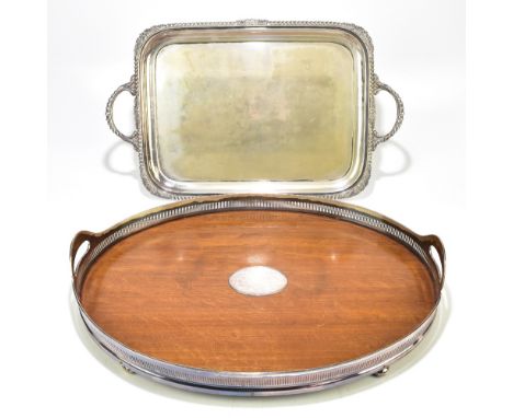 An&nbsp;Edwardian oak and silver plate mounted galleried twin handled tray, with vacant central oval panel,&nbsp;length 62cm,