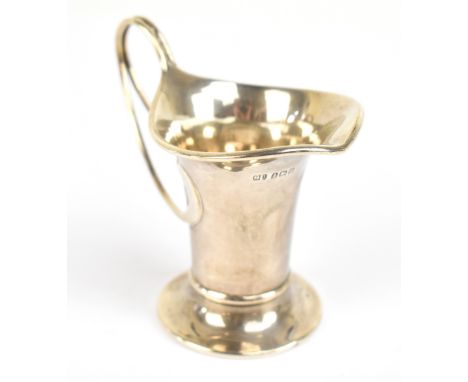 GEORGE UNITE; a George V hallmarked silver cream jug with Art Nouveau style handle, Birmingham 1911, height 8cm, approx weigh