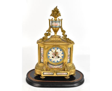 JAPY FRERES; a late 19th century French ormolu eight day mantel clock with Servres-style porcelain mounts, urn surmount and a