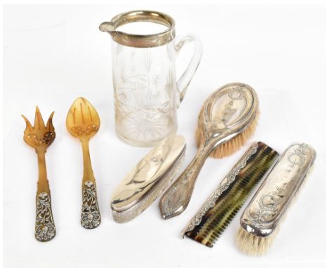 A group of hallmarked silver mounted items to include a cut glass water jug with hallmarked silver rim, height 16cm, a hobnai