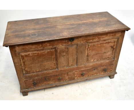 An 18th century oak coffer with panelled front above two base drawers, height 76cm, width 127cm, depth 52.5cm.Additional Info