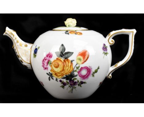 A porcelain teapot with gilt and enamel heightened decoration, the lid with moulded foliate detail, with hatched blue mark to