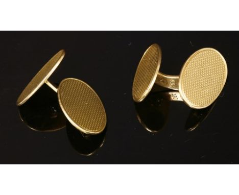 A pair of Continental gold swivel plate link cufflinks, each with a pair of flat section oval plates, with fine barley engine