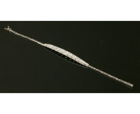 An Art Deco diamond set bracelet, c.1925, with a centrepiece composed of graduated old brilliant cut, old European cut and ol