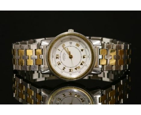 A ladies' bicolour Hermès 'Clipper' quartz bracelet watch, the circular case, 26mm diameter, with a white enamel dial, gilt R