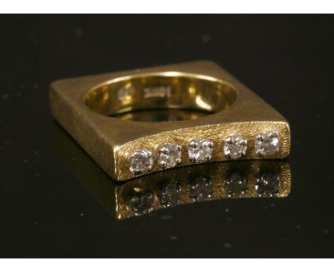 A gold five stone diamond set square shaped ring, c.1960, with five brilliant cut diamonds, all four claw set in white collet