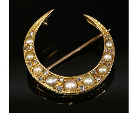 An Edwardian gold, split pearl and diamond crescent brooch, with a row of graduated split pearls with pairs of rose cut diamo