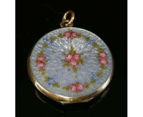 A Continental silver and enamelled circular hinged locket, with a sky blue guilloché enamel ground. Clusters and garlands of 