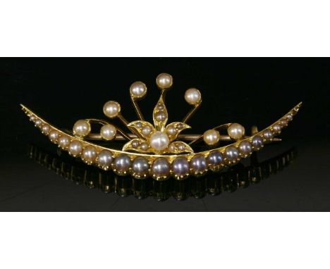 A late Victorian gold seed pearl and split pearl crescent brooch, with a line of graduated split pearls, in shades of cream, 