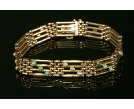 An Edwardian four row gold gate bracelet, with alternating diagonal rows of either three split pearls or three cabochon turqu