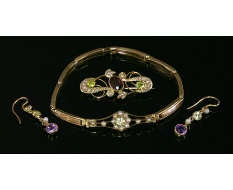 A Edwardian gold, yellow sapphire and split pearl gold bracelet, with a blade edge bar, lozenge-shaped centrepiece, with a pe