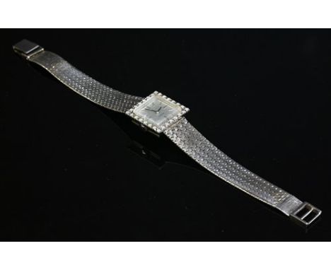 A ladies' white gold diamond set Zenith mechanical bracelet watch, with a square silvered dial, with raised silvered batons a