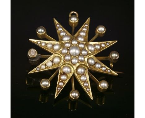 A late Victorian gold and split pearl starburst brooch, c.1900, with a split pearl cluster to the centre. The star rays, each