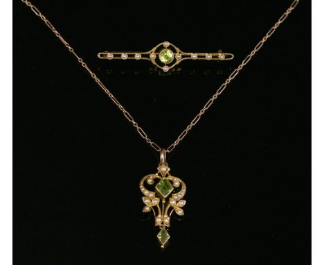 An Edwardian gold, peridot and split pearl pendant, with a lozenge, step cut peridot, milligrain set to the centre, a scrolli