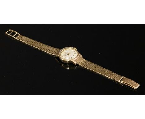 A ladies' 9ct gold Omega automatic strap watch, with a later 9ct gold bracelet. Circular case, 22.1mm diameter, with a silver