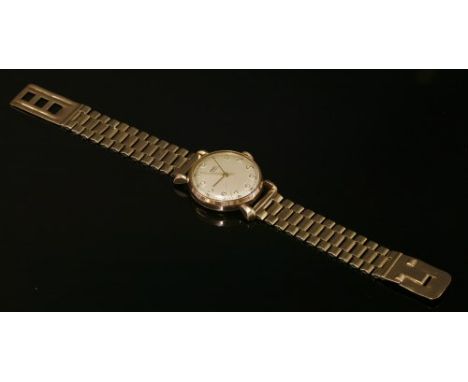A gentlemen's 9ct gold Ebel automatic strap watch, c.1950, with a later gold bracelet by Chaincraft. A circular case, 32mm di