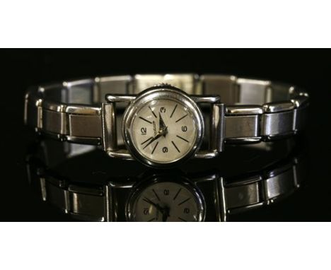 A ladies' stainless steel Jaeger LeCoultre rear wind mechanical strap watch, with a later expanding bracelet. Circular case 1