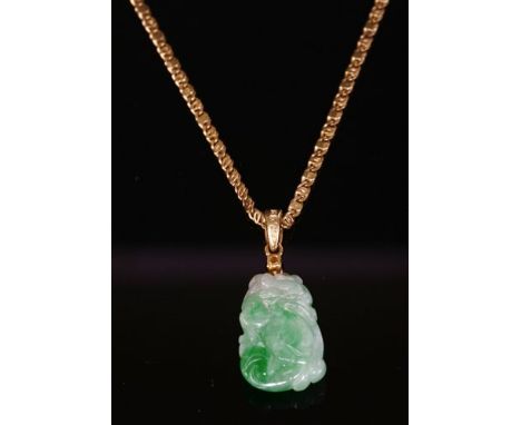 A Chinese carved jade and diamond gourd pendant, with a tapered rectangular jade plaque depicting a gourd. A brilliant cut di