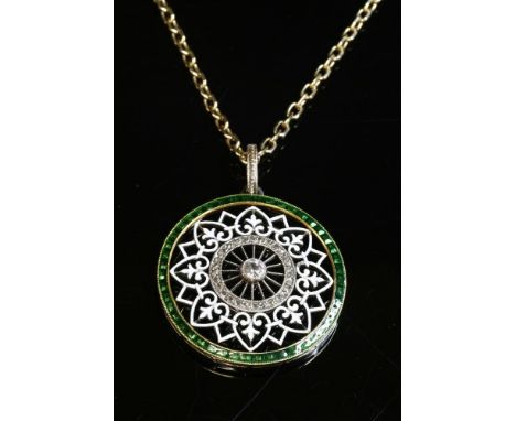 A Belle Époque diamond and enamel pendant, c.1915, of open circular form. An old European cut diamond, milligrain set to the 