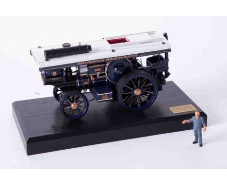 A Bassett Lowke precision scale white metal model of a traction engine, on stand, length 15cm, 68/500 with certificate.