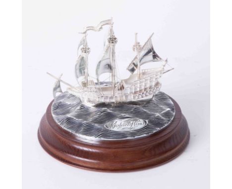 Royal Mint silver model of The Golden Hind upon circular choppy sea, 12cm diameter on wood base, from a limited edition of 25