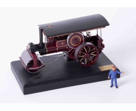 A Bassett Lowke precision scale white metal model of a traction steam roller, on stand, length 17cm, 134/2000 with certificat