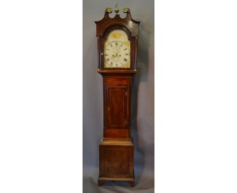 A George III Mahogany and Inlaid Long Case Clock, the swan neck pediment with brass finial above an arched door flanked by re