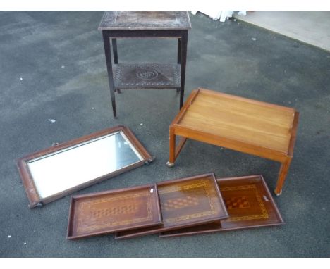 Walnut and Tunbridge ware over mantel mirror, a carved oak two tier occasional table, a set of three graduating inlaid trays 