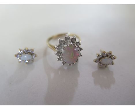 A 9ct yellow gold opal and diamond ring and earrings - ring size K - opal size in ring 10mm x 6mm - total weight approx 4 gra