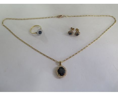 An 18ct yellow gold suite of diamond and sapphire jewellery to include a ring - size J/K, a pendant on a 44cm chain, sapphire