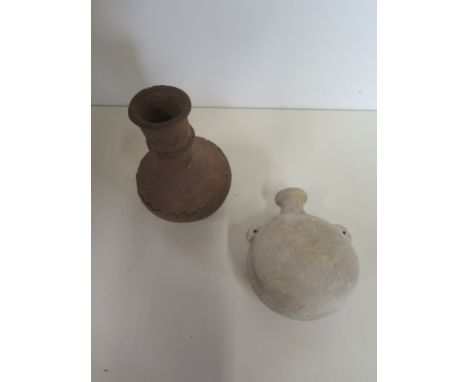 A Roman white pottery flask - un-earthed in Palastine and a red pottery bottle 