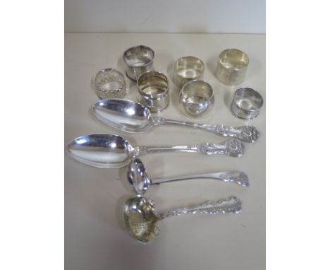 A collection of silver items including two large Victorian silver tablespoons, a small Scottish silver ladle, a Sterling silv