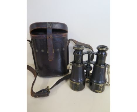 A pair of WW1 binoculars, stamped with a broad arrow MK V SPL 54791, with leather case, stamped Oak Leather Goods Co 1916, le