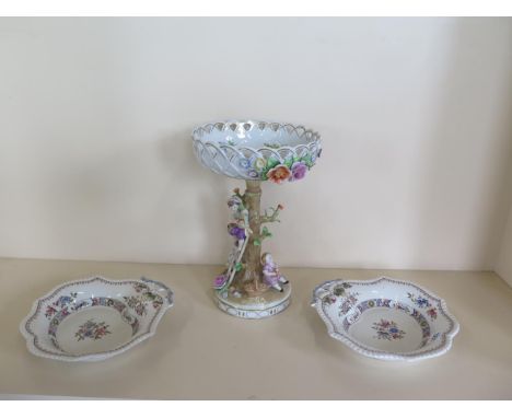 A Continental flower encrusted porcelain centre piece 33cm tall, and a pair of Spode Copeland serving dishes for Waring and G