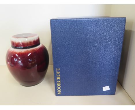 An experimental Moorcroft stoneware Bulls blood flambe ginger jar and cover - 20cm tall - boxed, good condition 