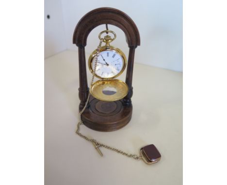 A Rotary side wind pocket watch with plated chain and 9ct fob on a wooden stand, clean running order 