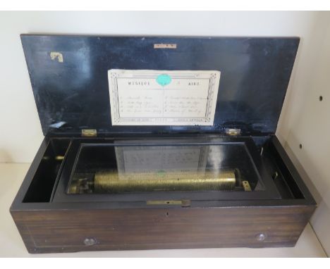 A 19th Century music box, French playing eight tunes, retailed by C Sivel & Co, Cork, condition report - all pins and comb te