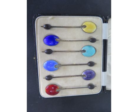 A boxed set of six silver enamel coffee spoons, approx 1.5 troy oz, two have chipped enamel, rest are good 