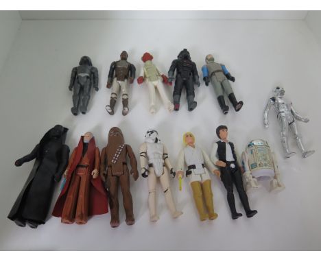 Seven 1977 Star Wars action figures including Luke Skywalker, Obiwan Kenobi both with light sabres and vinyl cloaks, Hans Sol