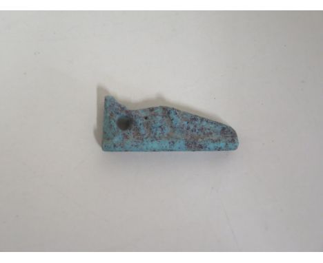 An ancient Egyptian faience crocodile amulet of a crocodile - length 2.8cm 