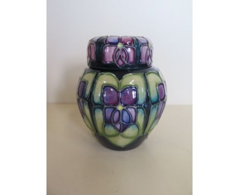 A Moorcroft Violet pattern lidded vase, approximately 11 cm high, with original box, with some flaws in glaze 