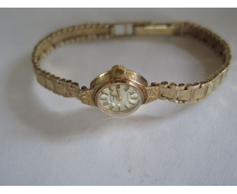 A ladies Rotary wristwatch with 9 ct gold bracelet, approximately 13 g overall, watch currently running in saleroom 