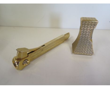 A Dunhill gilt gas table lighter and a Dottatus Soligen cigar cutter, see images for condition 